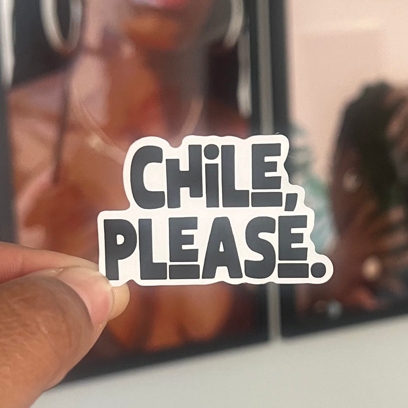 Hand holding a 'Chile, Please.' sticker with blurred background