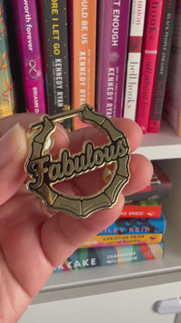 video compilation of enamel pin with fabulous written on it